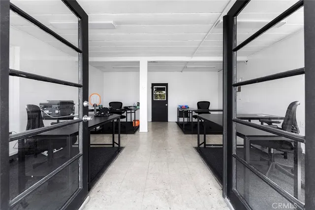 a view of a workspace with furniture