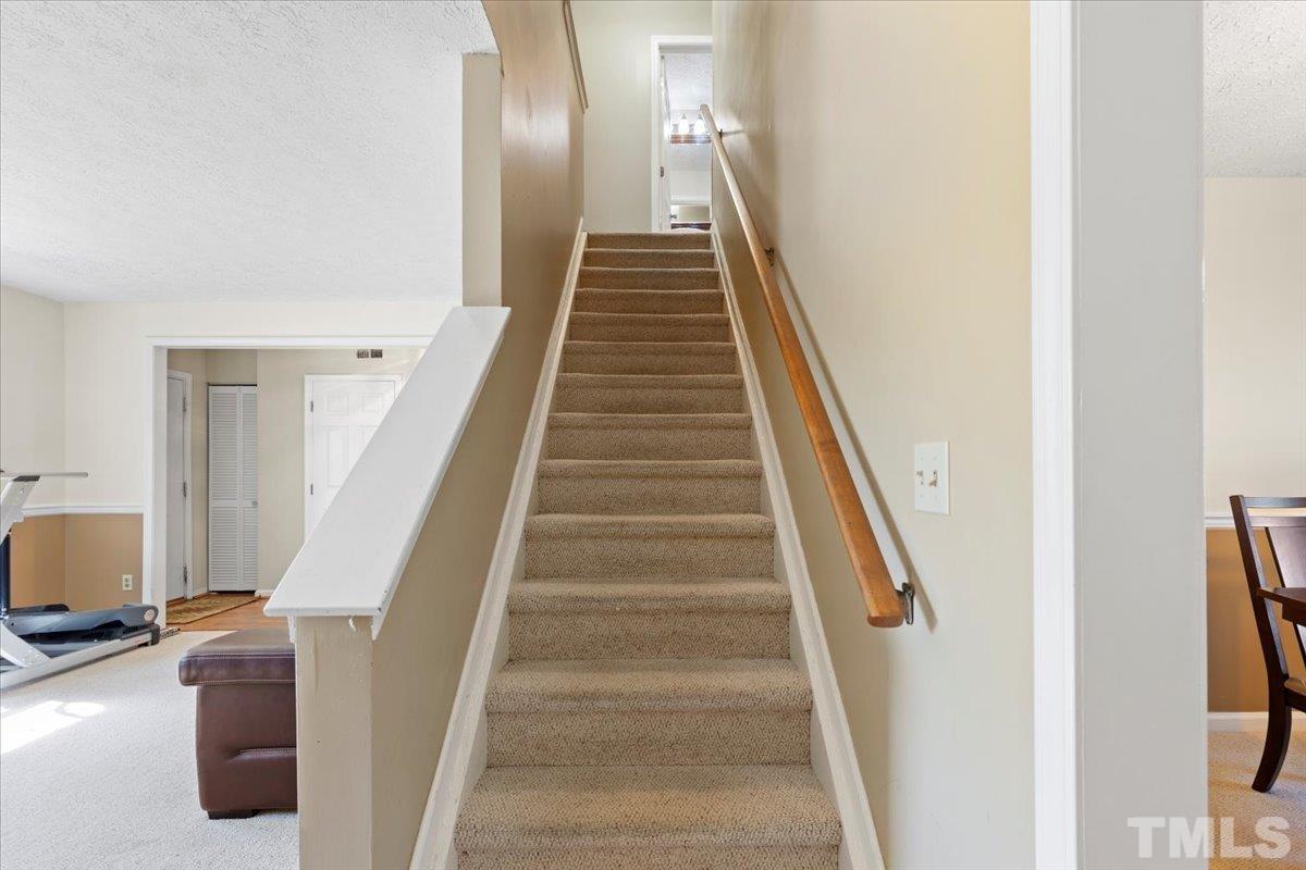 8224 Wynewood Court Raleigh, NC 27616 - Photo 15 of 29 a view of entryway and hall with wooden floor