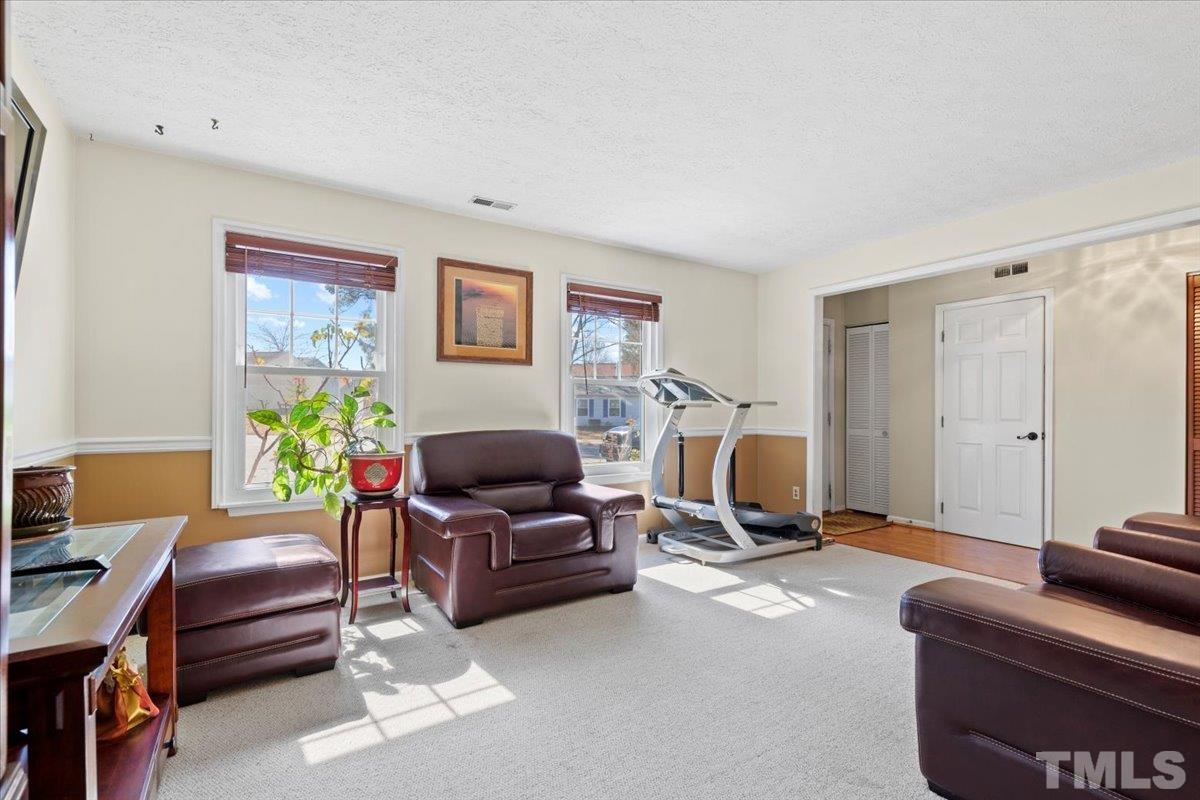 8224 Wynewood Court Raleigh, NC 27616 - Photo 6 of 29 a living room with furniture and a window