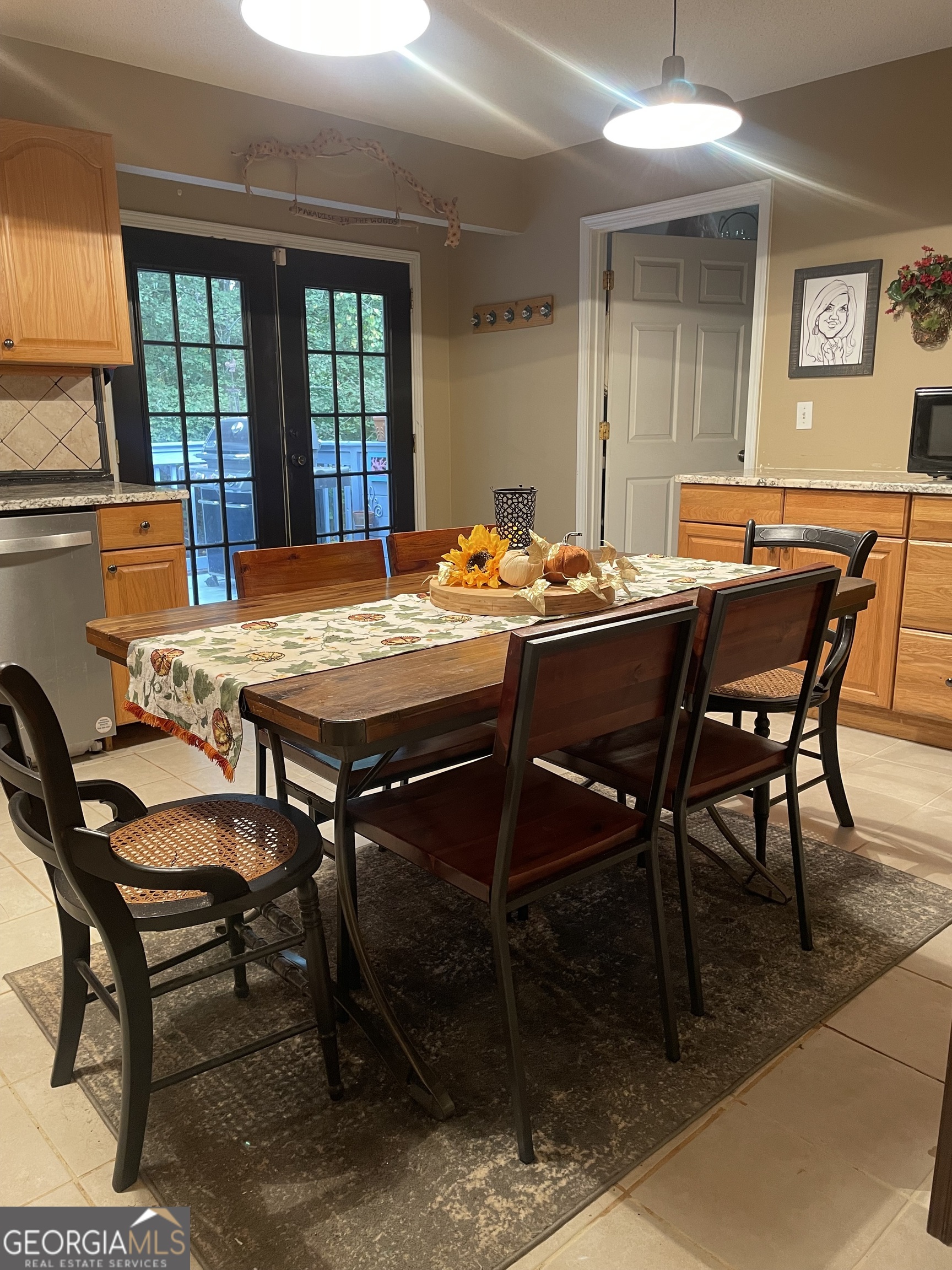 3010 Turner Church Road McDonough, GA 30252 - Photo 12 of 27 a view of a dining room and livingroom with furniture a rug a rug and a painting