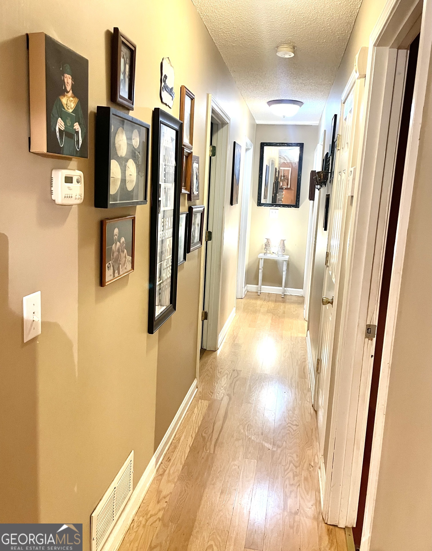 3010 Turner Church Road McDonough, GA 30252 - Photo 13 of 27 a view of a hallway with windows and wooden door