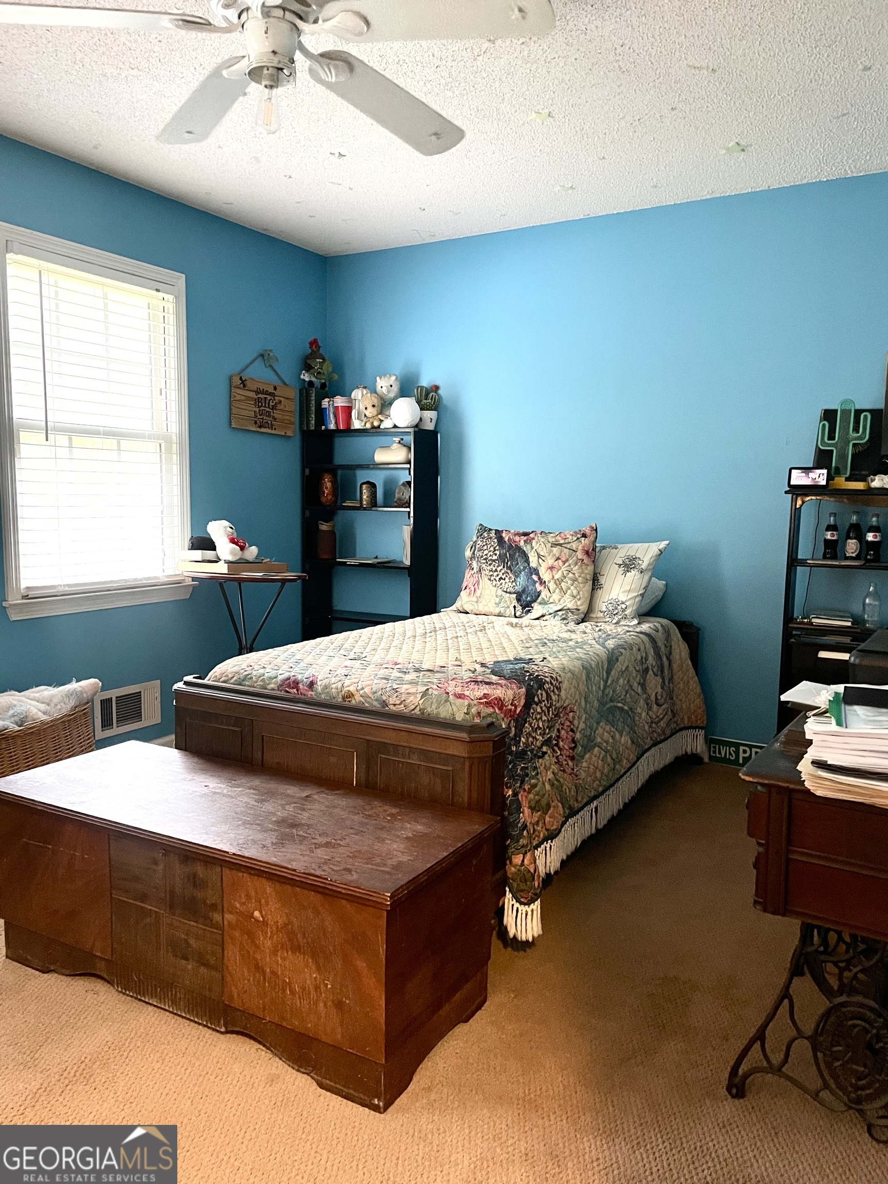 3010 Turner Church Road McDonough, GA 30252 - Photo 16 of 27 a bedroom with a bed and a chandelier