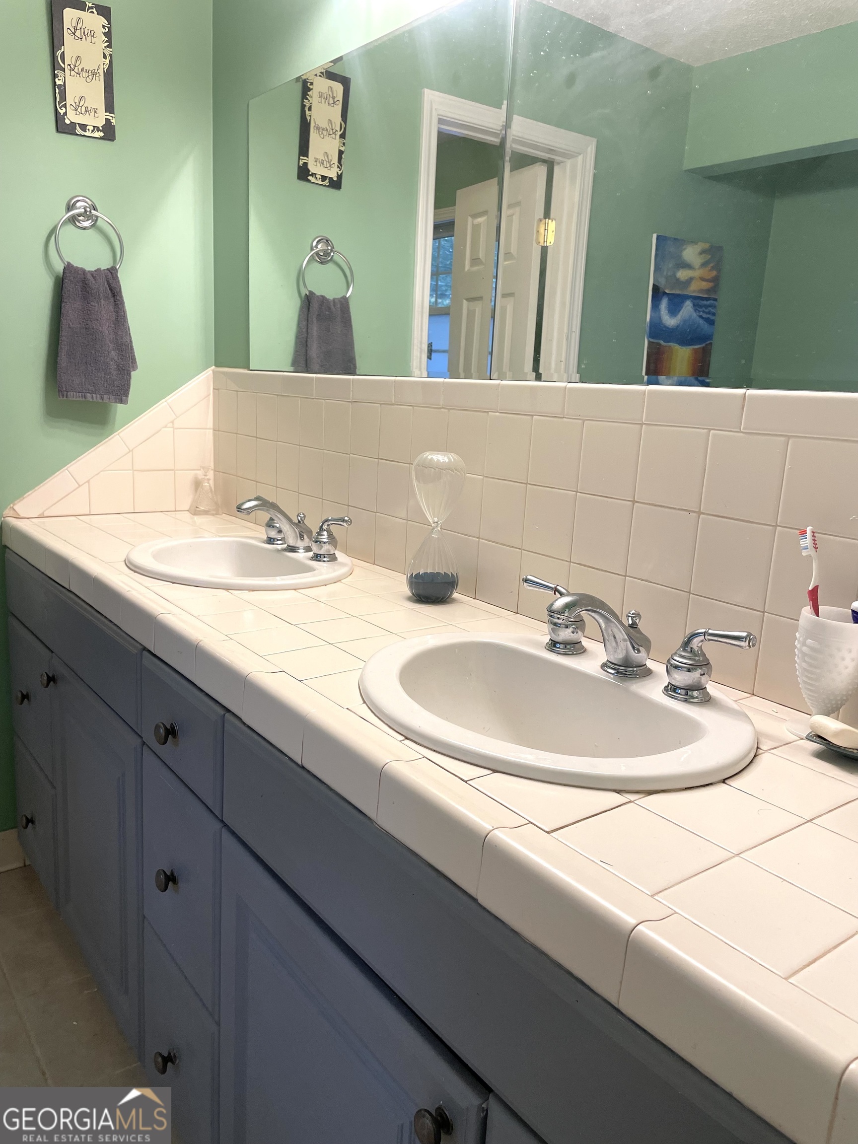 3010 Turner Church Road McDonough, GA 30252 - Photo 20 of 27 a bathroom with a sink and a mirror