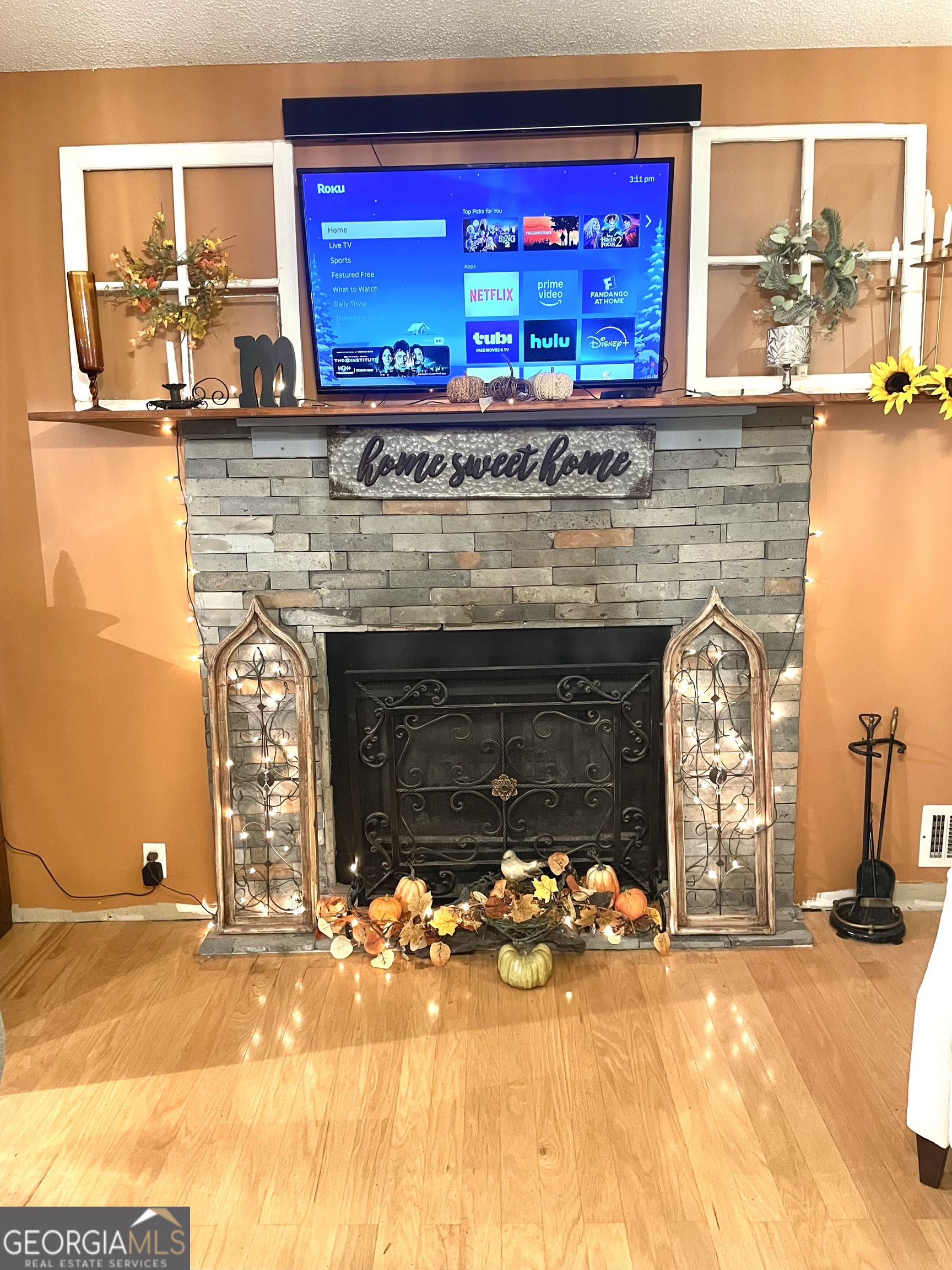 3010 Turner Church Road McDonough, GA 30252 - Photo 7 of 27 a view of a fireplace with wooden floor