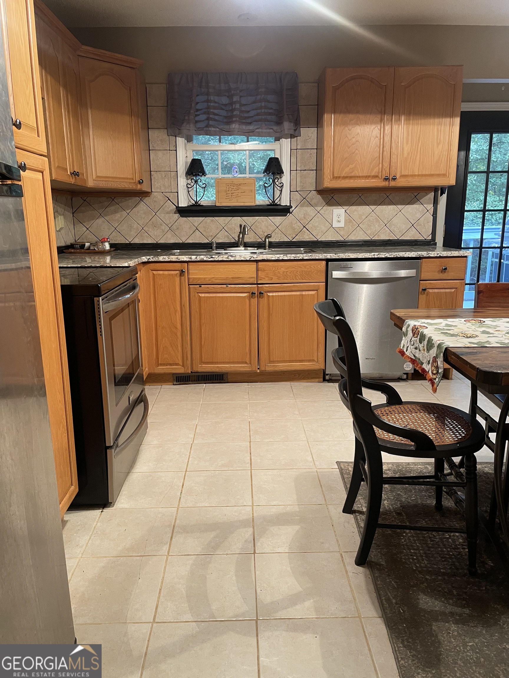 3010 Turner Church Road McDonough, GA 30252 - Photo 8 of 27 a kitchen with stainless steel appliances granite countertop a sink and cabinets
