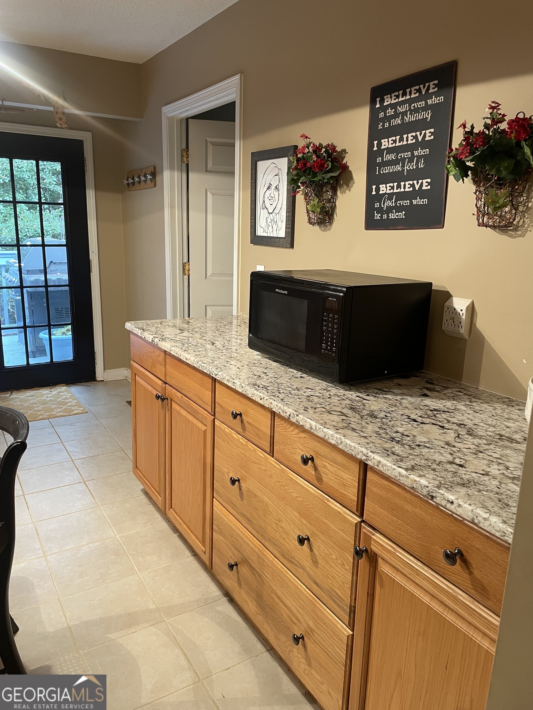 3010 Turner Church Road McDonough, GA 30252 - Photo 10 of 27 a living room with granite countertop cabinets and flat screen tv