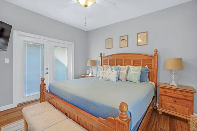 a bedroom with a bed and a chandelier