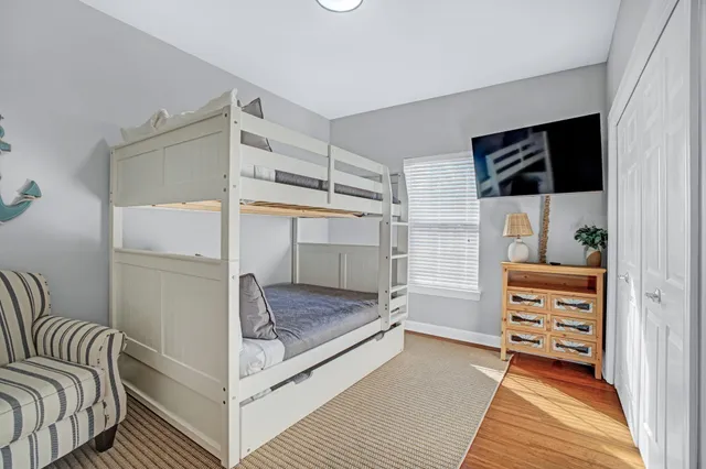 a view of a patio with a table and chairs under an umbrella
