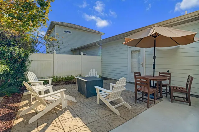 a patio with a table and chairs