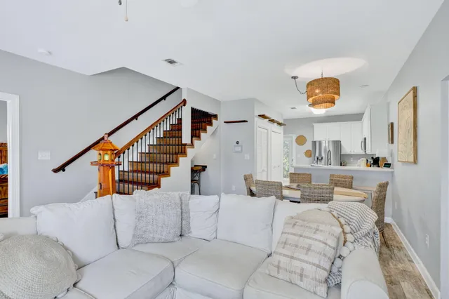 a living room with furniture and a painting