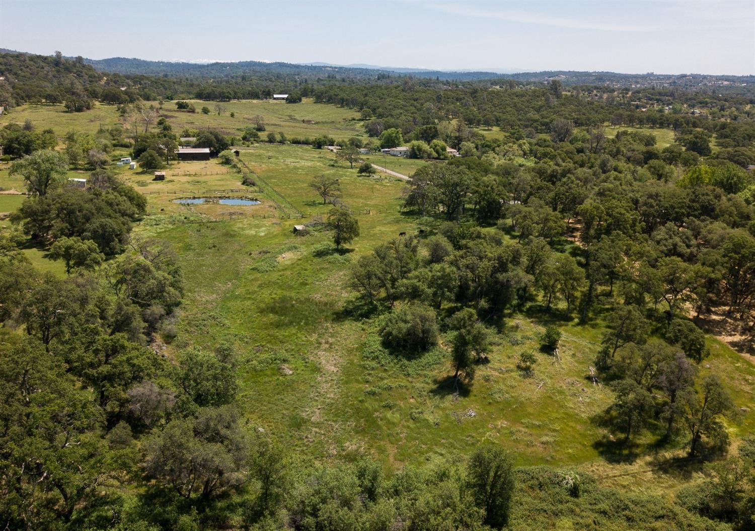 5445 Bell Road Auburn, CA 95602 - Photo 1 of 5 a view of a city with lush green forest