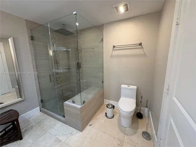 a front view of a multi story building with yard