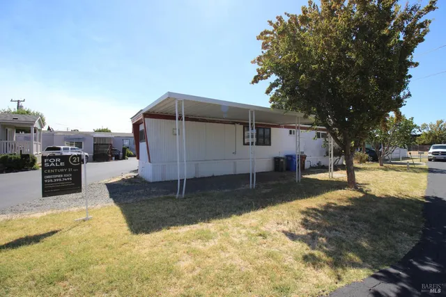 a view of an chairs and table in the balcony