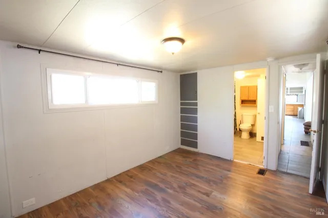 a bathroom with a granite countertop toilet sink and shower