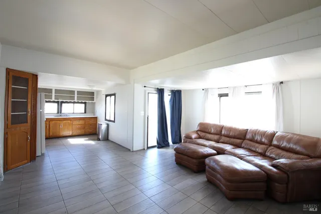 a view of livingroom with furniture and window