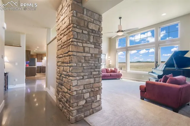 a lobby with furniture and a floor to ceiling window