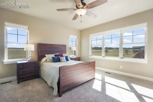 a bedroom with a bed next to a window