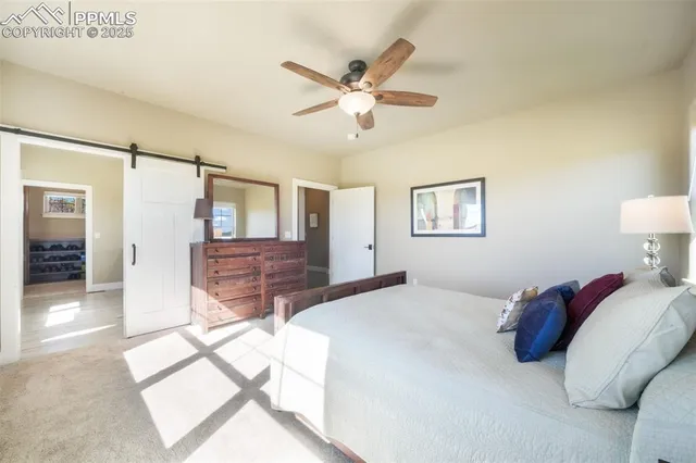 a bed room with a bed and a chandelier