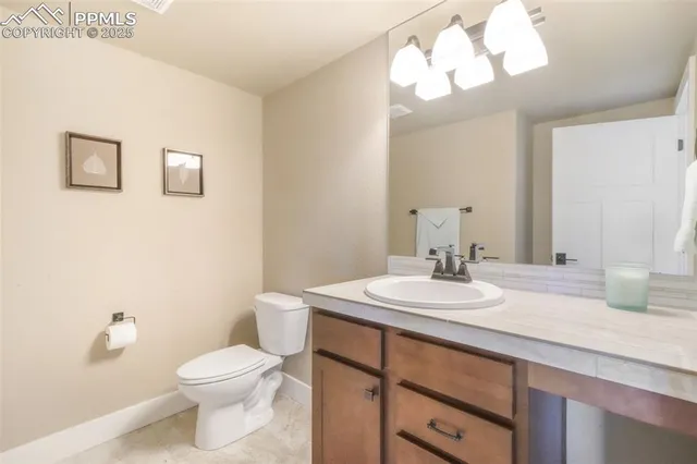 a bathroom with a sink a mirror and a toilet