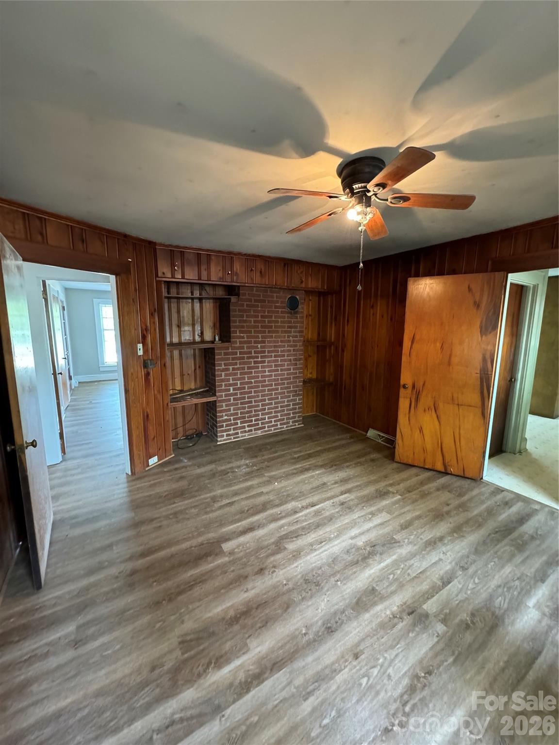 509 East Main Street Locust, NC 28097 - Photo 14 of 40 en empty room with wooden floor and windows