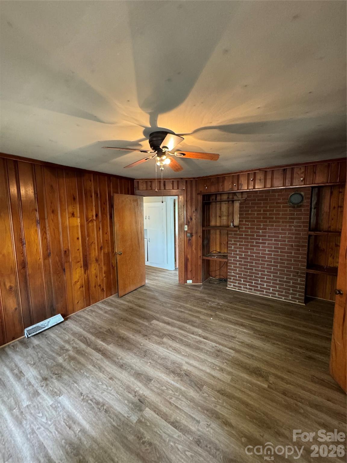 509 East Main Street Locust, NC 28097 - Photo 15 of 40 a view of an empty room with wooden floor and a window