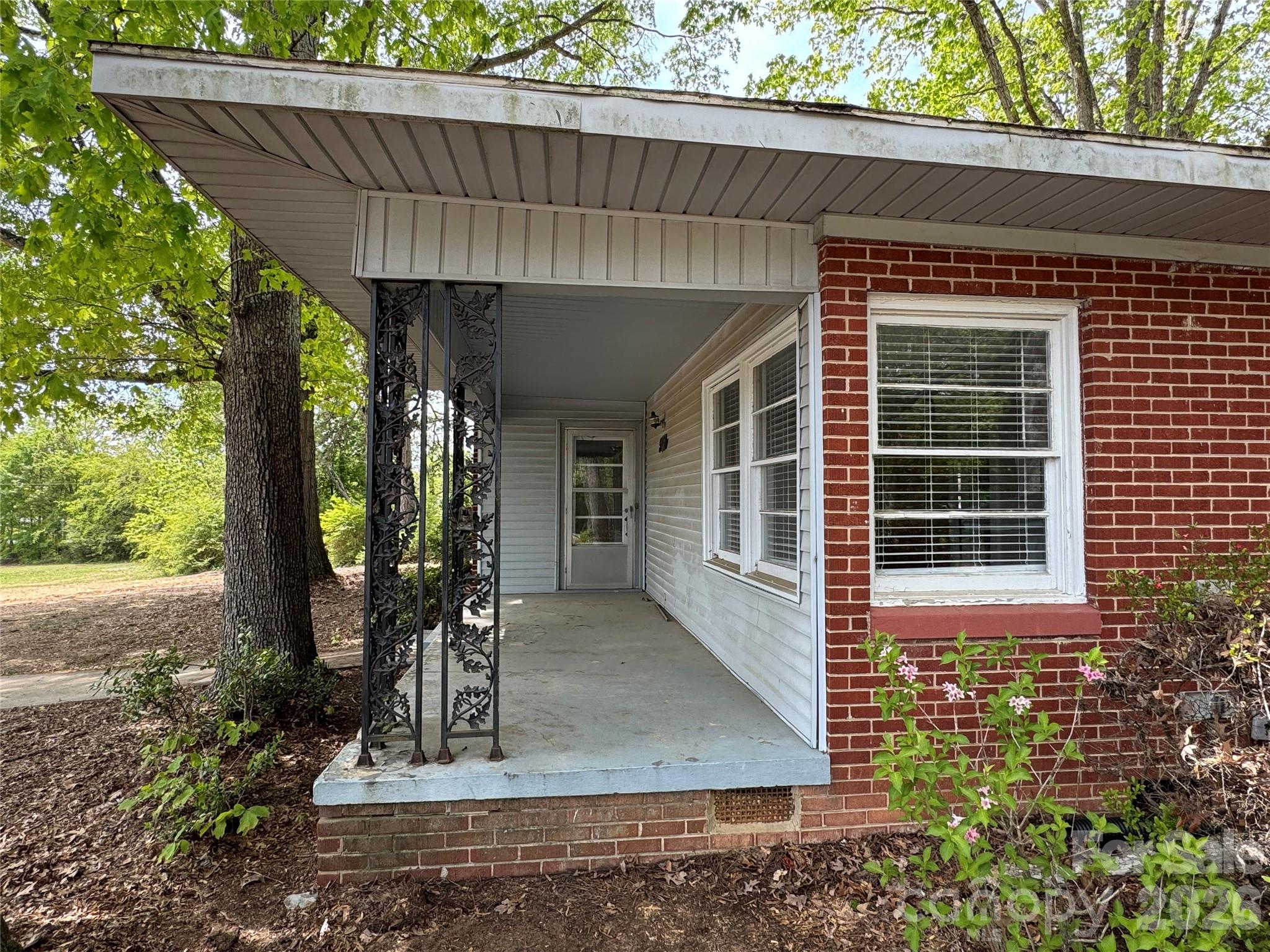509 East Main Street Locust, NC 28097 - Photo 2 of 40 a front view of a house with garden