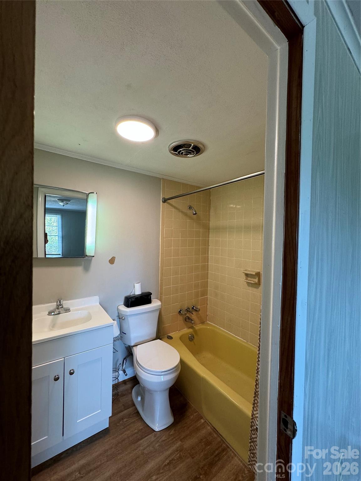 509 East Main Street Locust, NC 28097 - Photo 25 of 40 a bathroom with a toilet sink and mirror