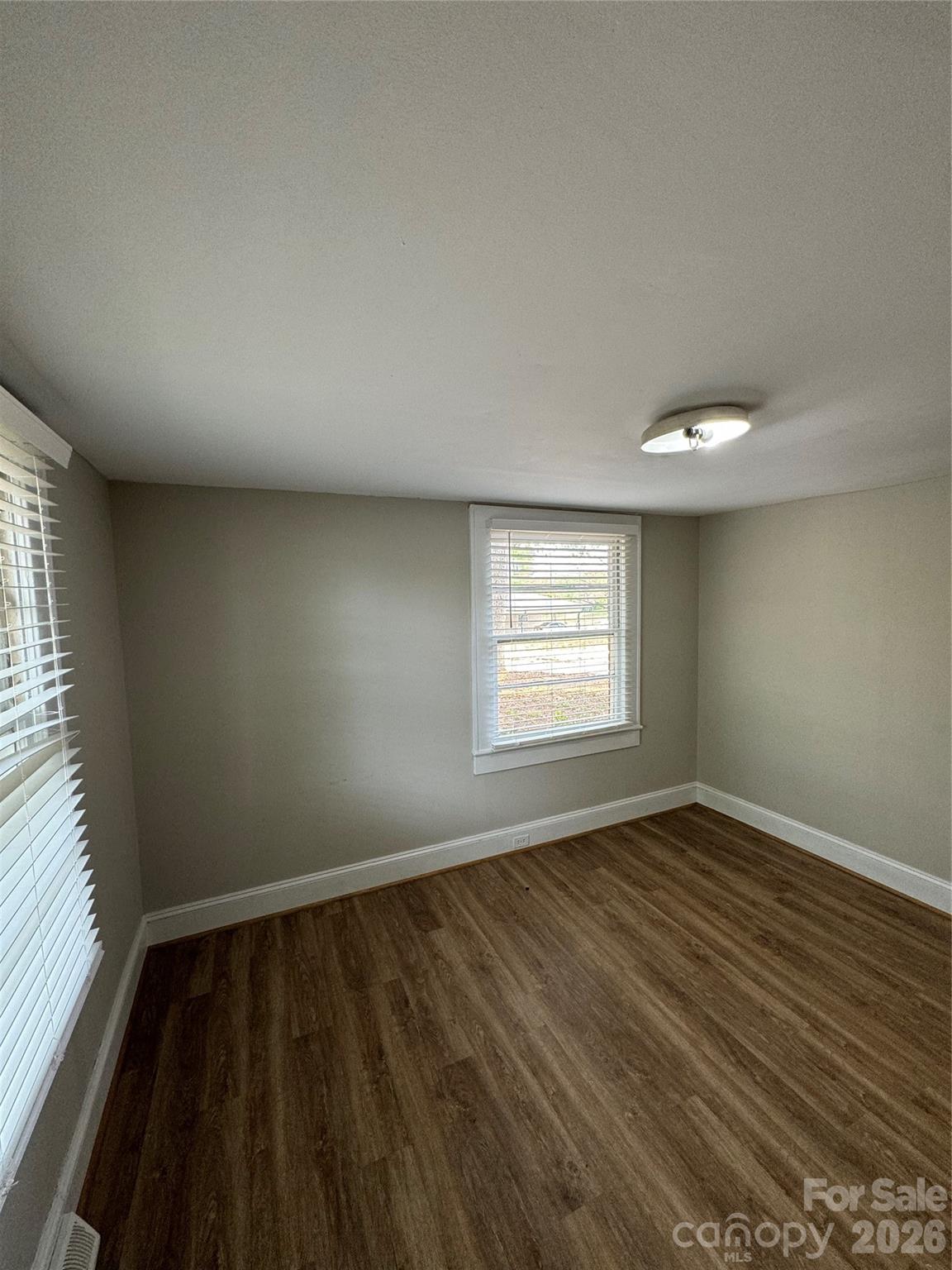 509 East Main Street Locust, NC 28097 - Photo 26 of 40 wooden floor in an empty room with a window