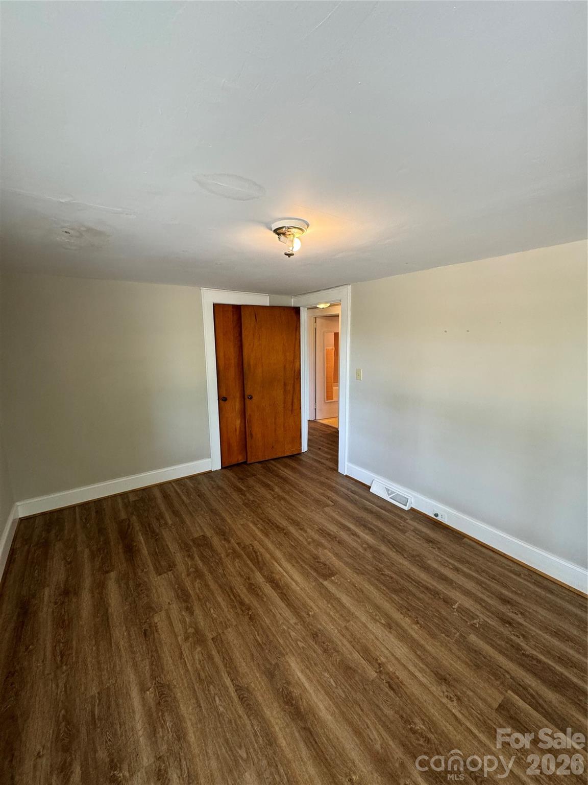 509 East Main Street Locust, NC 28097 - Photo 29 of 40 a view of an empty room and wooden floor