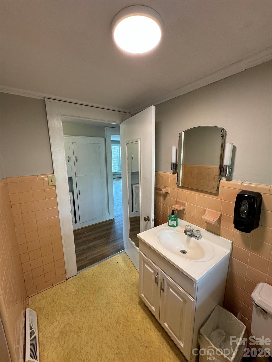 509 East Main Street Locust, NC 28097 - Photo 31 of 40 a bathroom with a sink toilet and mirror