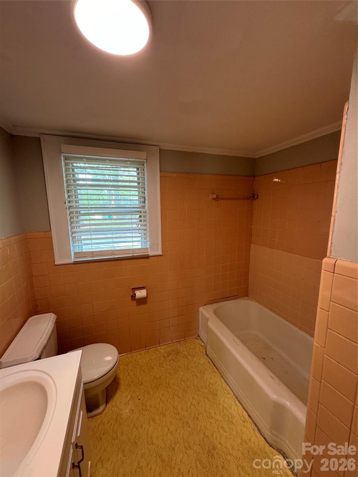 509 East Main Street Locust, NC 28097 - Photo 32 of 40 a bathroom with a toilet and sink