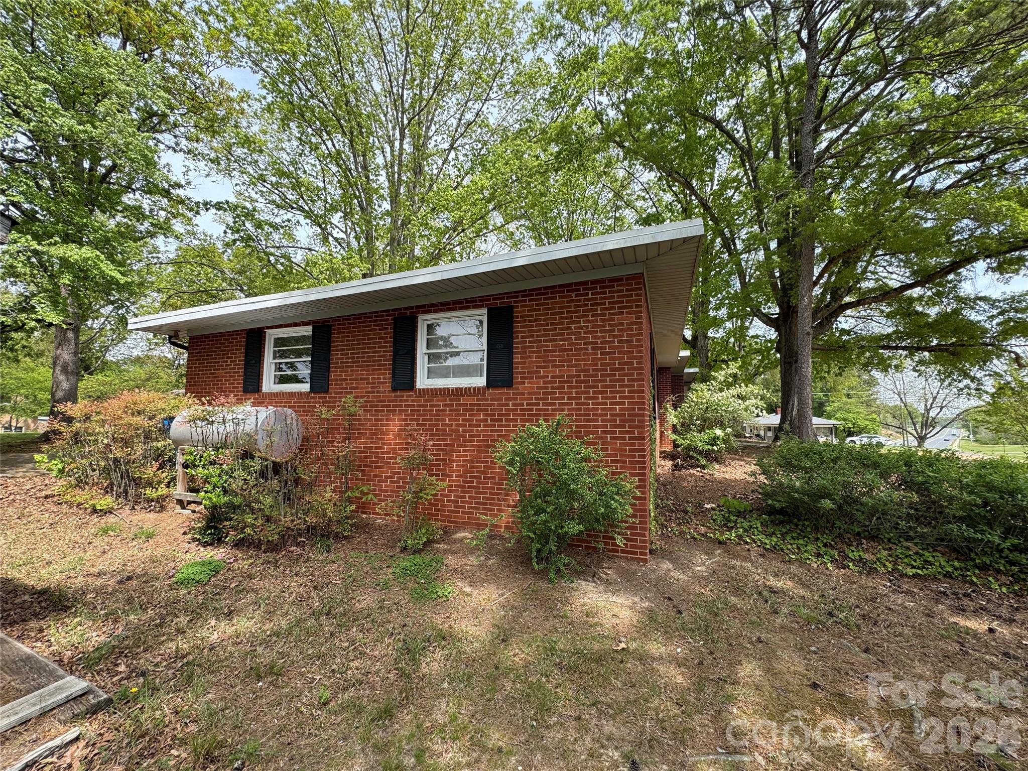 509 East Main Street Locust, NC 28097 - Photo 38 of 40 front view of a house with a yard