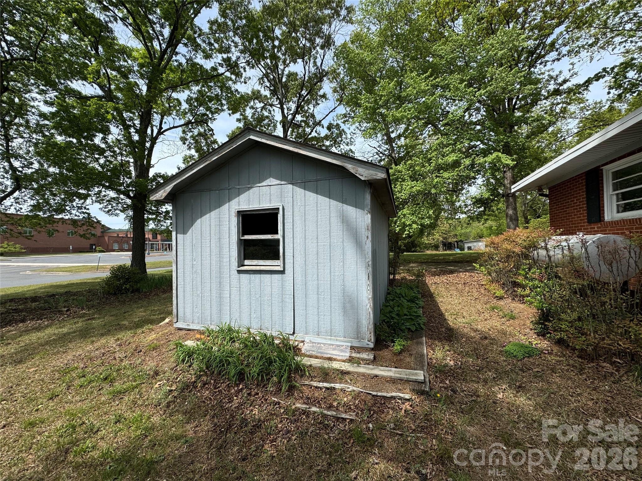 509 East Main Street Locust, NC 28097 - Photo 39 of 40 a front view of a house with garden