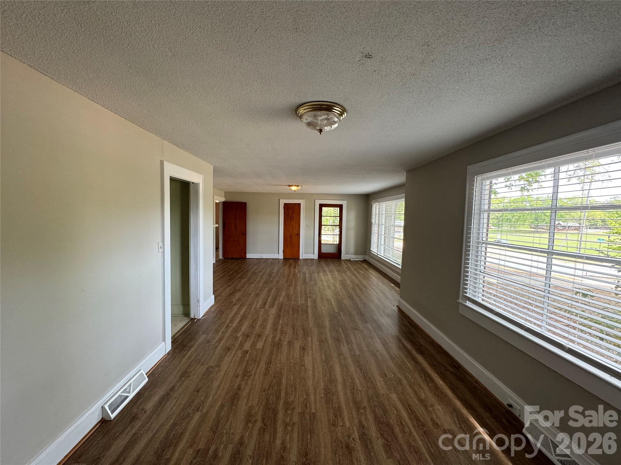 509 East Main Street Locust, NC 28097 - Photo 7 of 40 a view of a room with wooden floor and a window
