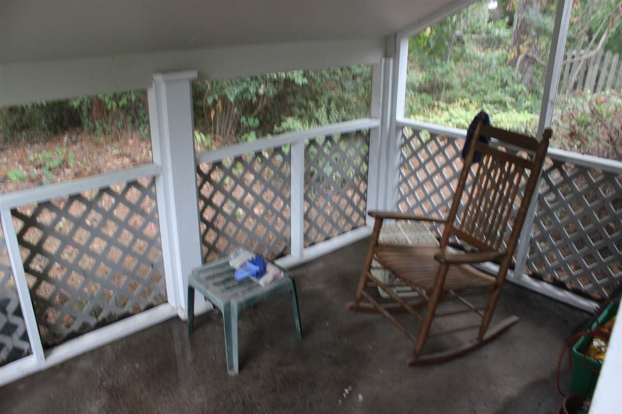 521 Mills Street Raleigh, NC 27608 - Photo 12 of 16 SCREENED-IN PORCH