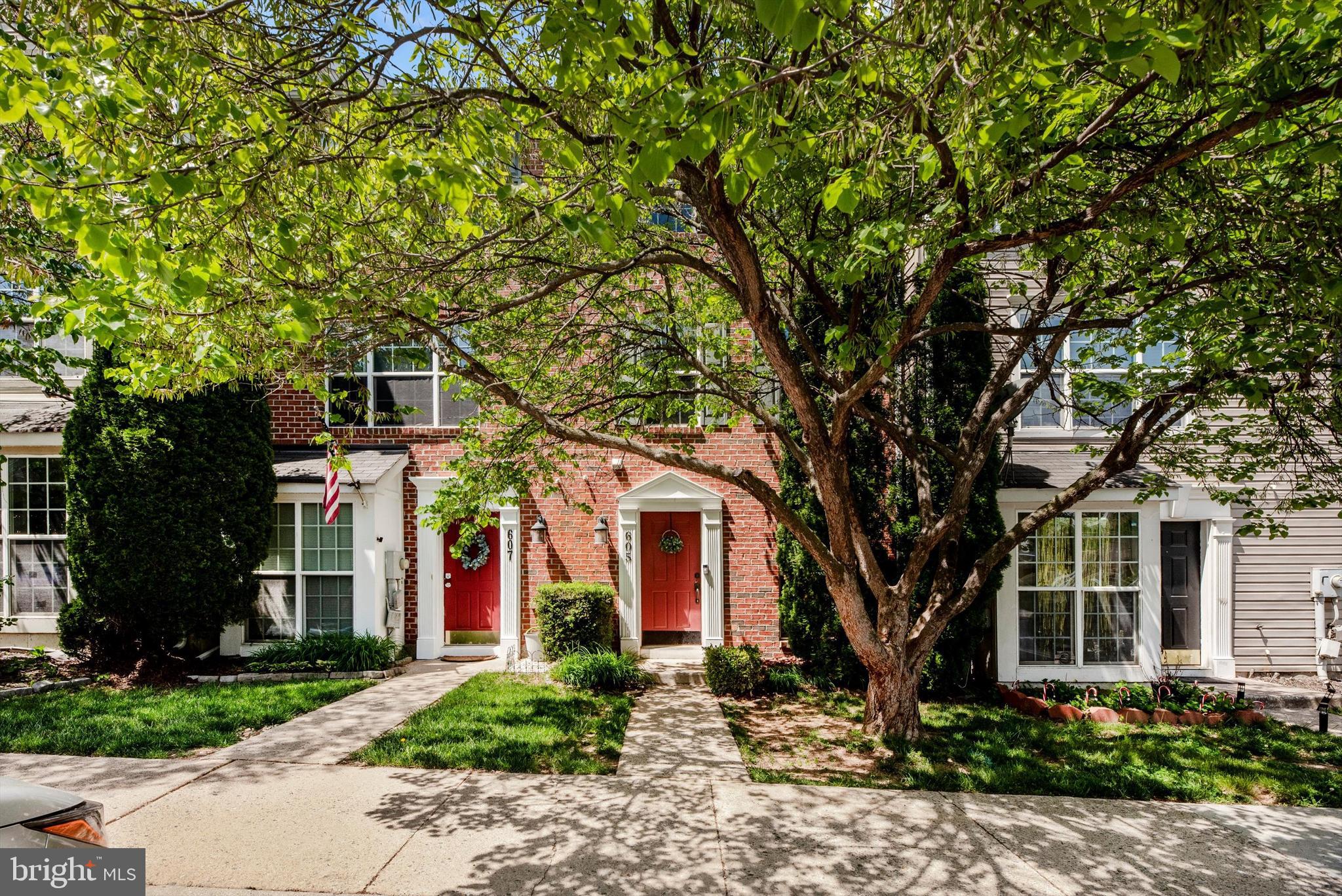 front view of a house with a tree