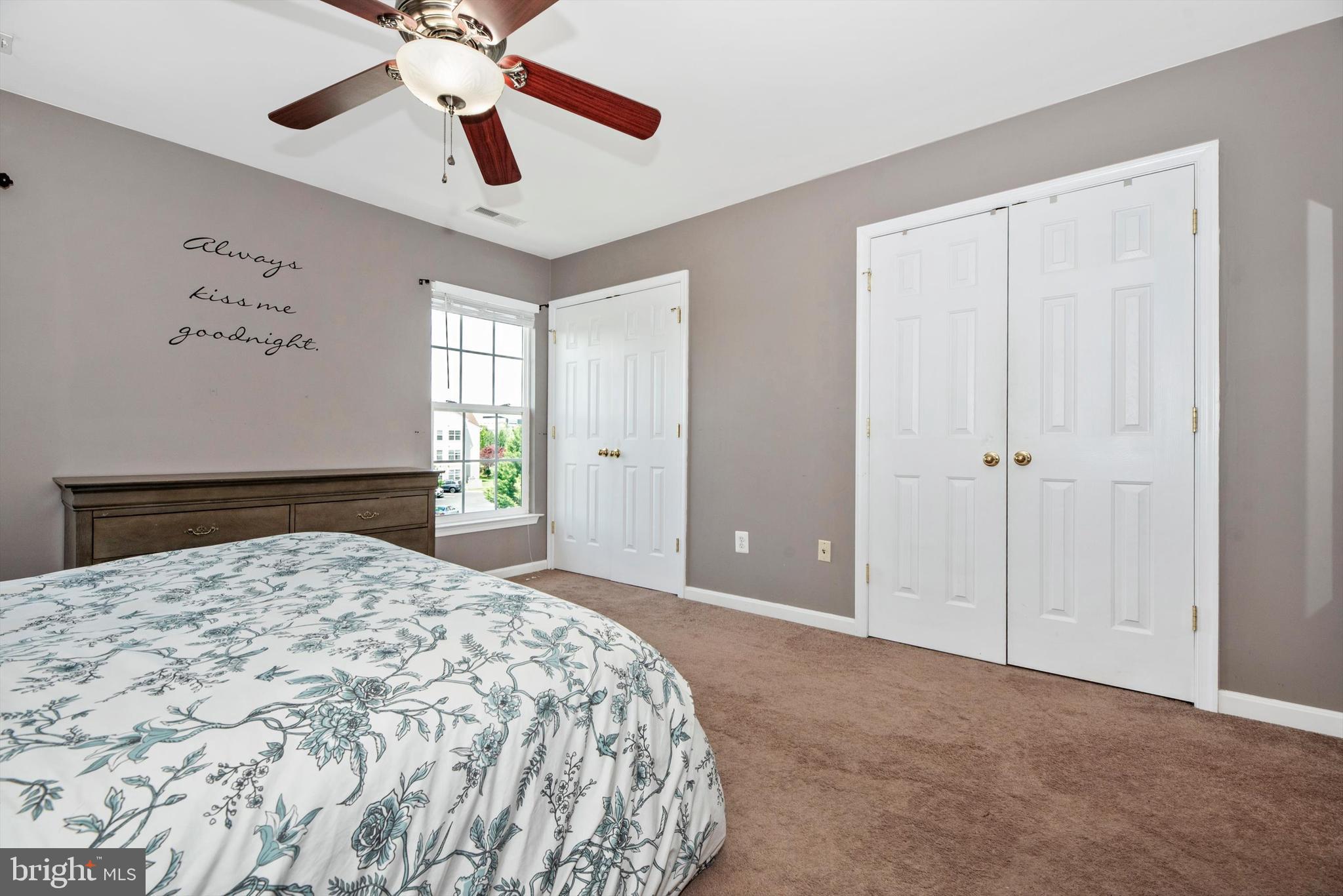605 Tivoli Road Frederick, MD 21703 - Photo 15 of 35 a bedroom with a large bed and a chandelier