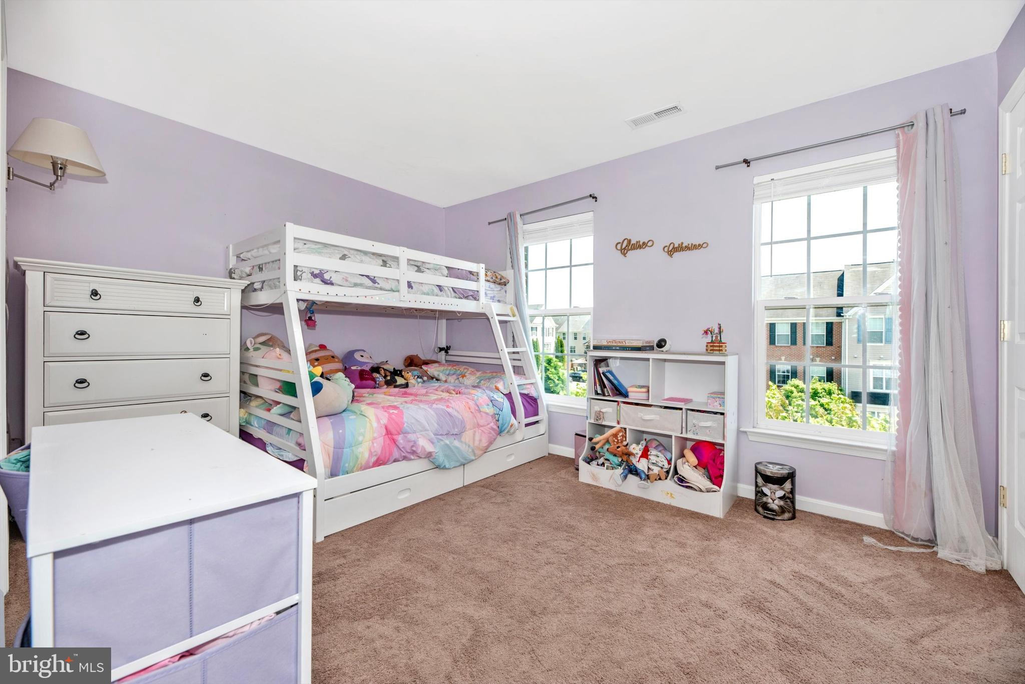 605 Tivoli Road Frederick, MD 21703 - Photo 19 of 35 a bedroom with a bed and a window