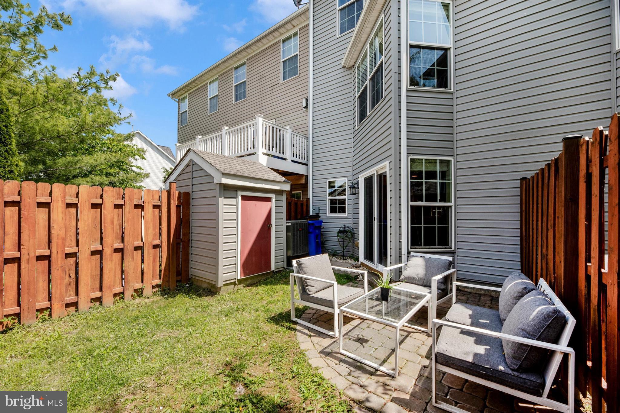 605 Tivoli Road Frederick, MD 21703 - Photo 26 of 35 a view of a chairs and table in backyard of the house