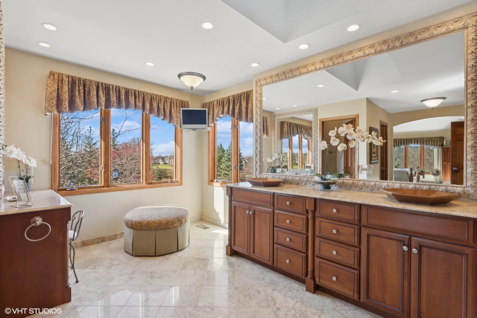321 Ridge Lane Lake In The Hills, IL 60156 - Photo 20 of 46 a spacious bathroom with a double vanity sink a large mirror and a bathtub