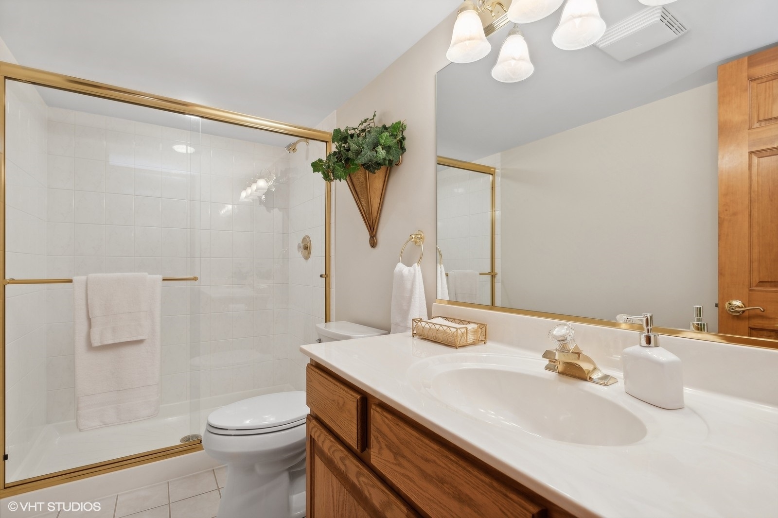 321 Ridge Lane Lake In The Hills, IL 60156 - Photo 32 of 46 a bathroom with a sink a toilet and shower
