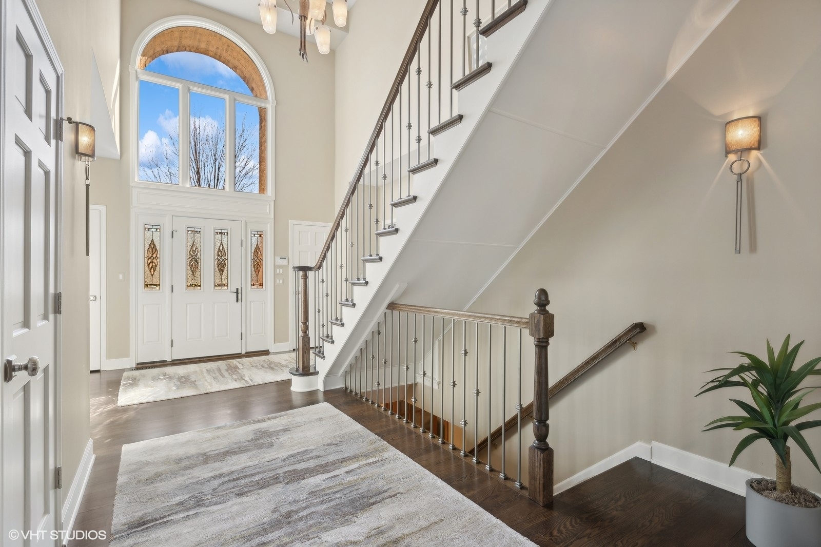 321 Ridge Lane Lake In The Hills, IL 60156 - Photo 7 of 46 a view of staircase with lots of frames on wall and wooden floor