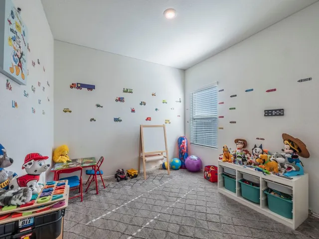 a bedroom with furniture and a window