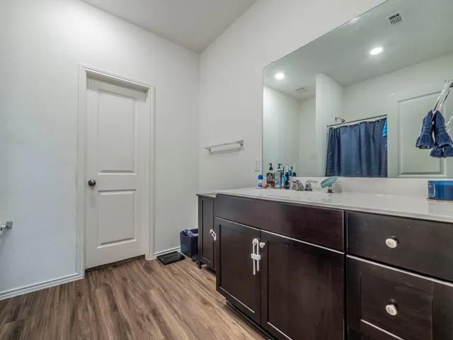 a room with a sink and a mirror