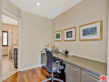 a workspace with furniture and wooden floor