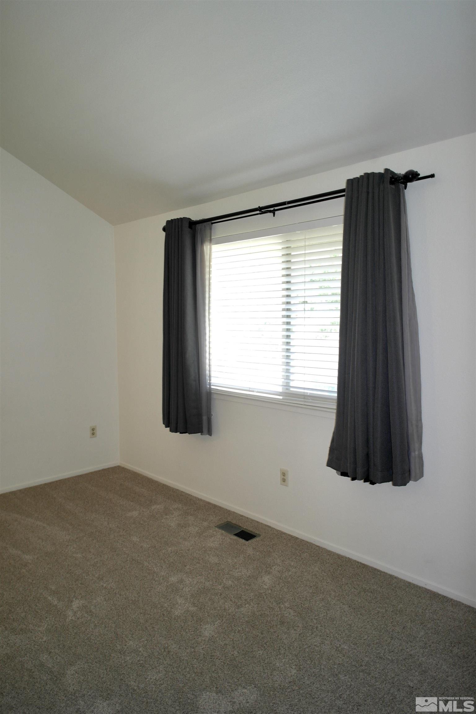 1187 Wagon Wheel Circle Reno, NV 89503 - Photo 13 of 29 an empty room with a window