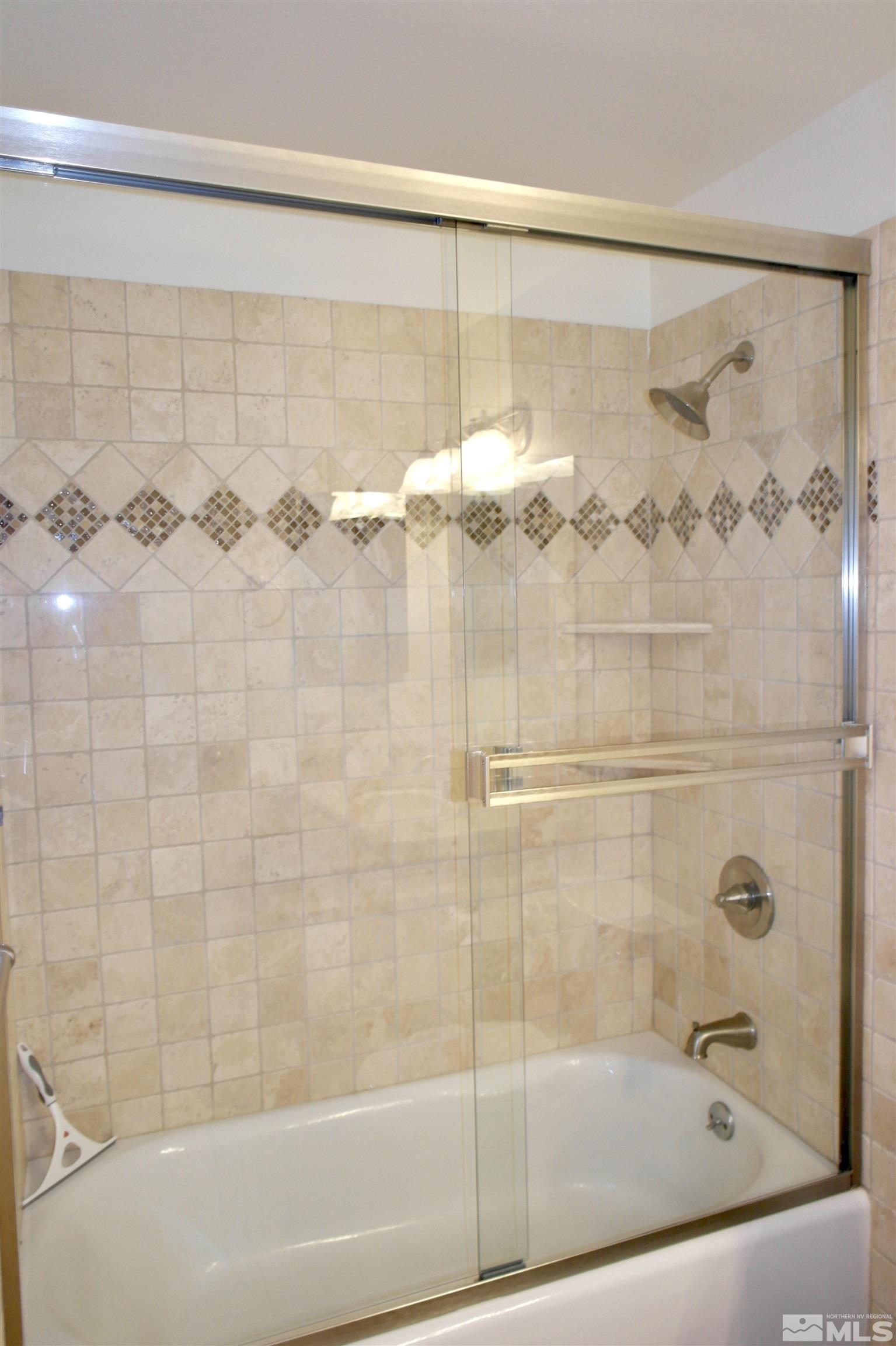 1187 Wagon Wheel Circle Reno, NV 89503 - Photo 21 of 29 a bathroom with a shower and a bath tub