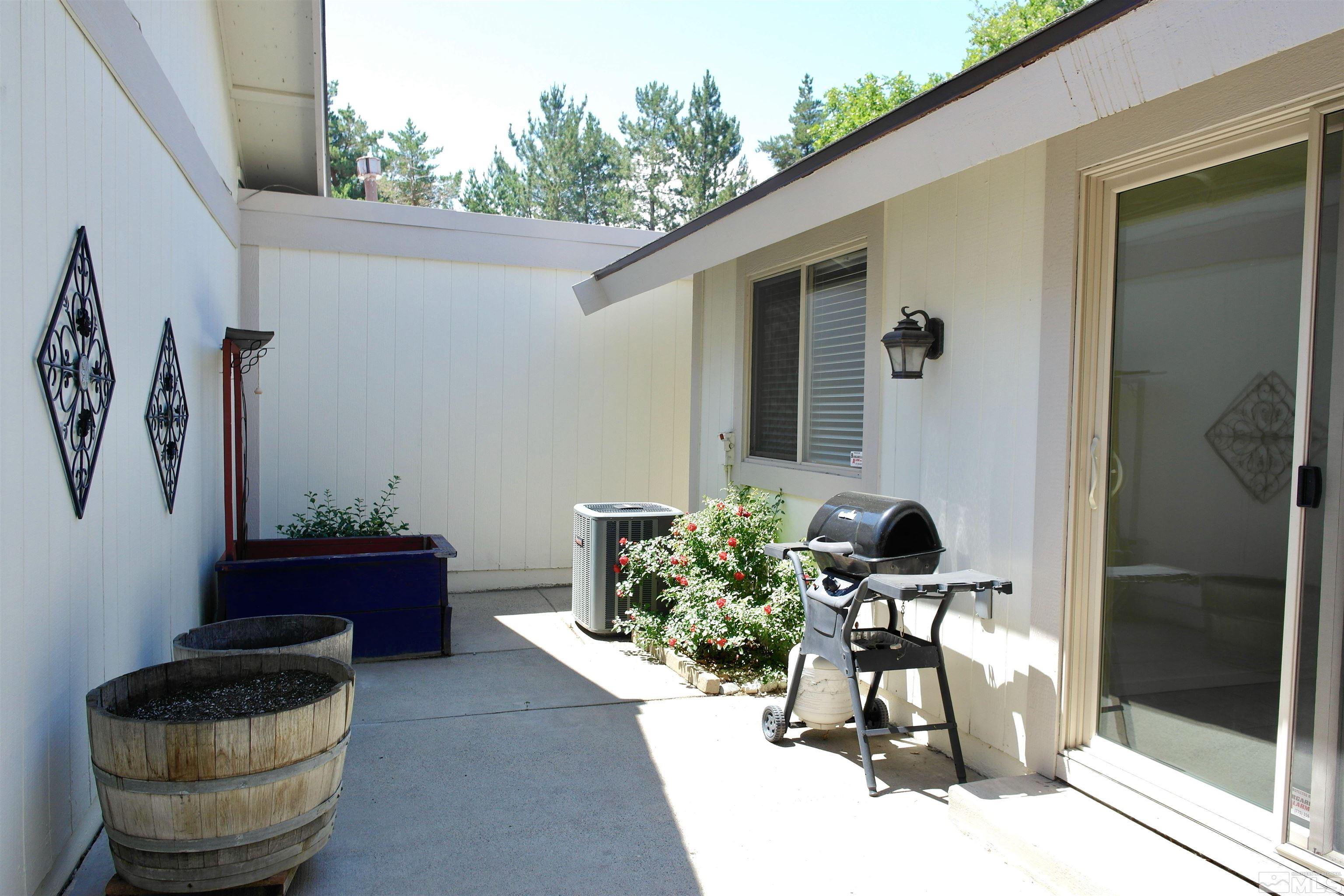 1187 Wagon Wheel Circle Reno, NV 89503 - Photo 23 of 29 a living room with patio furniture and a potted plant