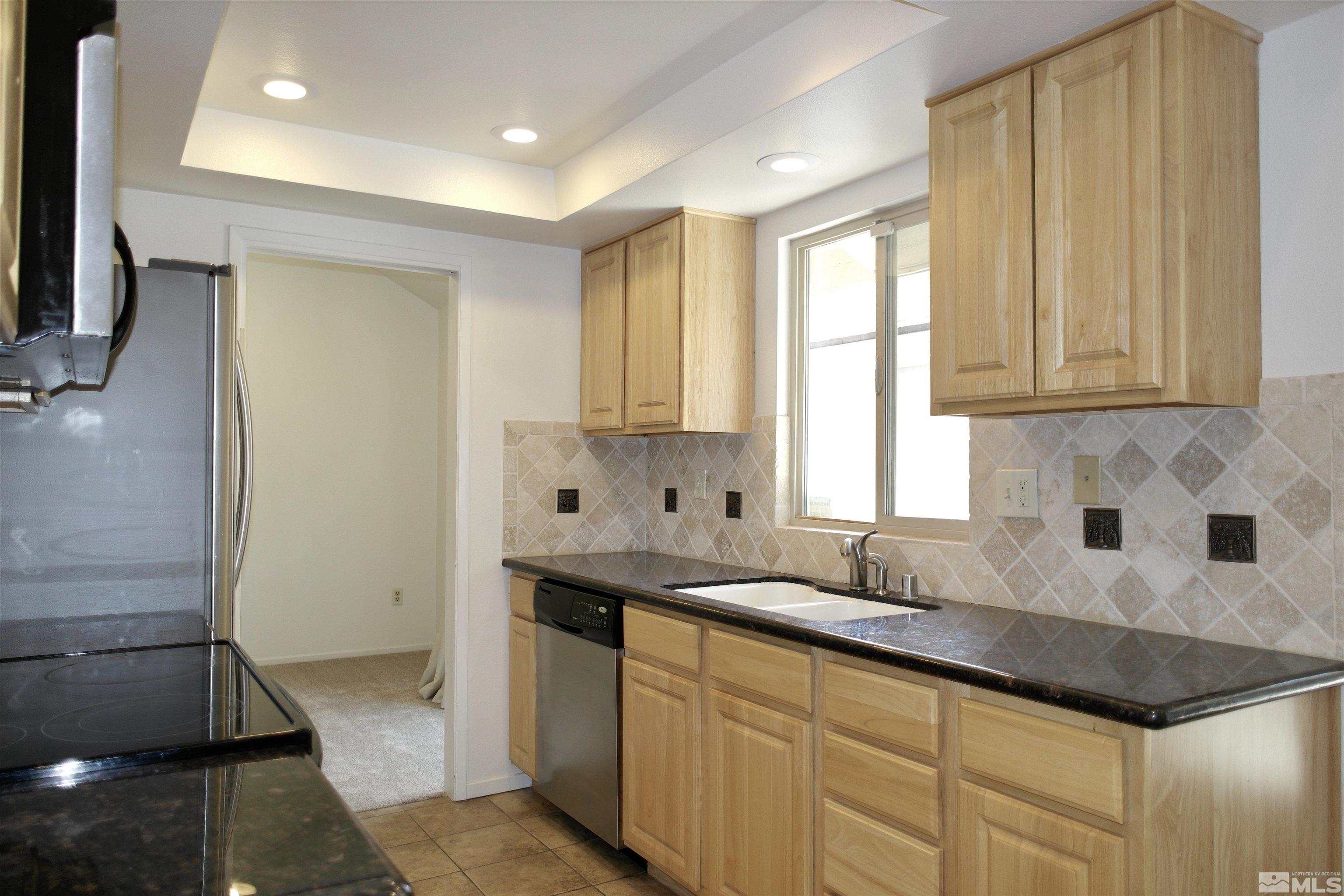 1187 Wagon Wheel Circle Reno, NV 89503 - Photo 5 of 29 a kitchen with a sink and cabinets