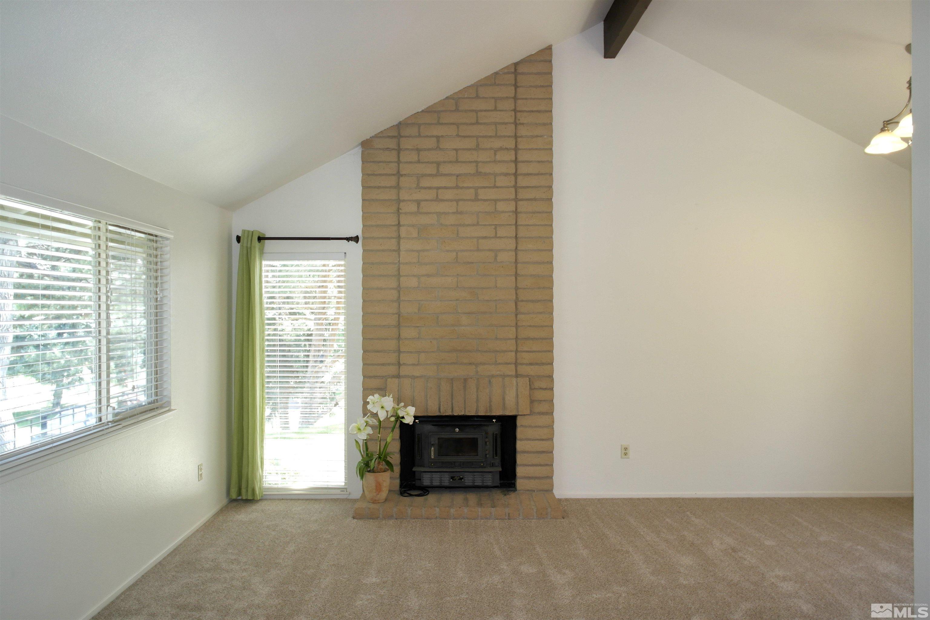 1187 Wagon Wheel Circle Reno, NV 89503 - Photo 9 of 29 an empty room with a fireplace